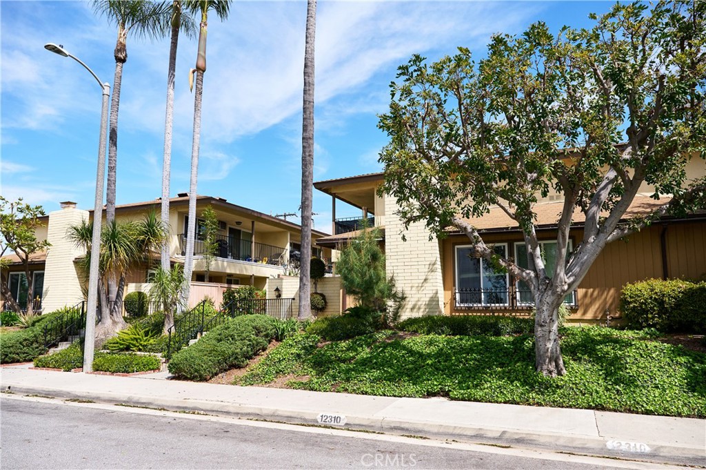 12310 La Pomelo Road La Mirada, CA 90638 - Photo 13 of 30 a front view of a house with a yard and trees