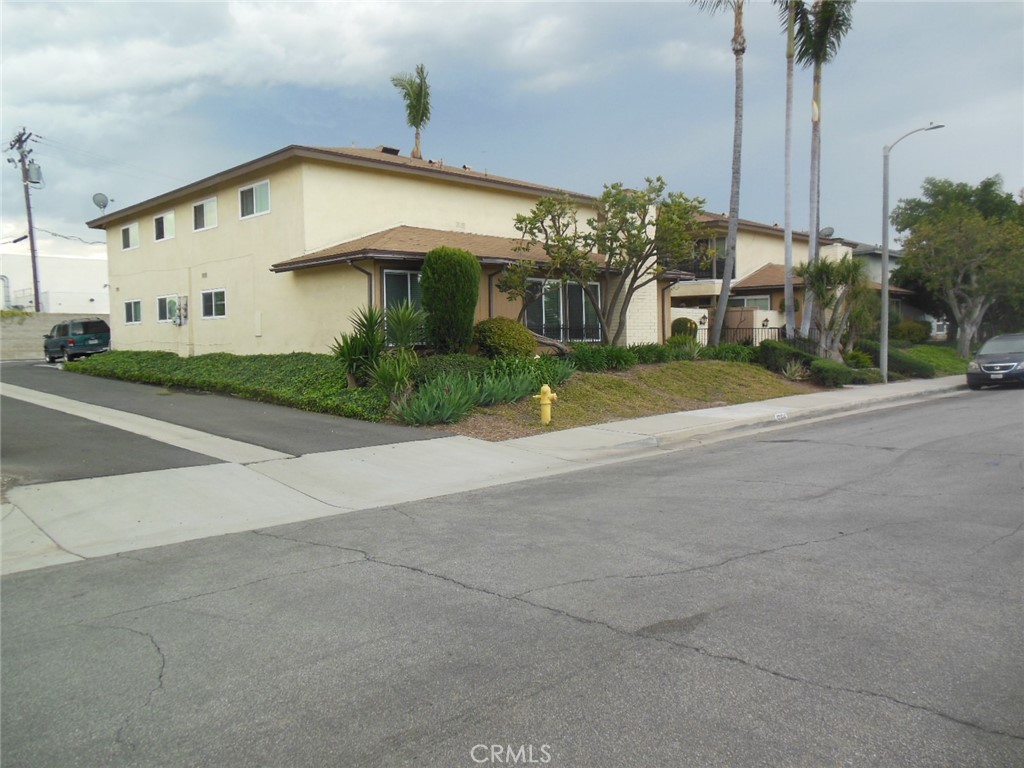 12310 La Pomelo Road La Mirada, CA 90638 - Photo 16 of 30 a front view of a house with a yard and garage