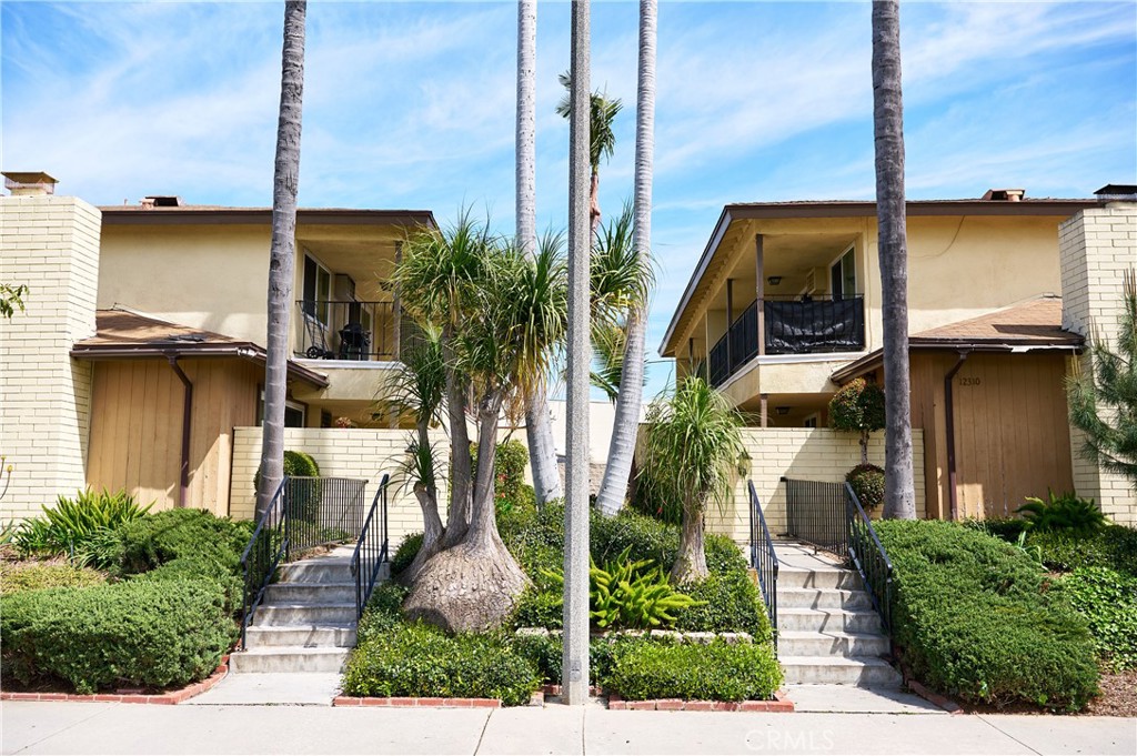 12310 La Pomelo Road La Mirada, CA 90638 - Photo 2 of 30 a front view of a house with a garden and plants