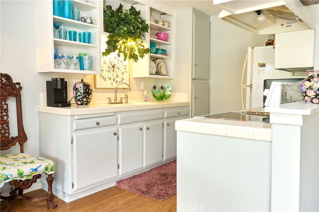 12310 La Pomelo Road La Mirada, CA 90638 - Photo 23 of 30 a kitchen with a sink and cabinets