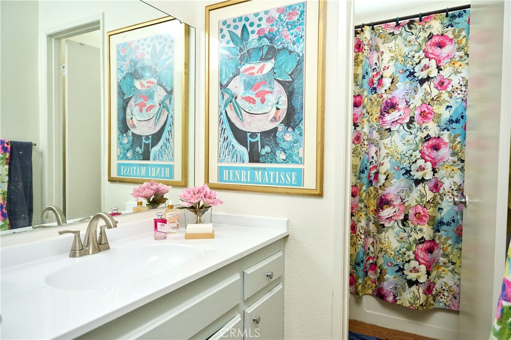 12310 La Pomelo Road La Mirada, CA 90638 - Photo 26 of 30 a bathroom with a sink and a mirror