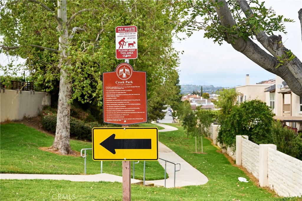 12310 La Pomelo Road La Mirada, CA 90638 - Photo 27 of 30 a sign that is sitting on a lush green field