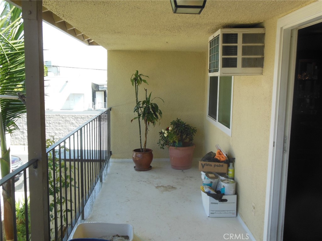 12310 La Pomelo Road La Mirada, CA 90638 - Photo 5 of 30 a view of a porch with potted plants