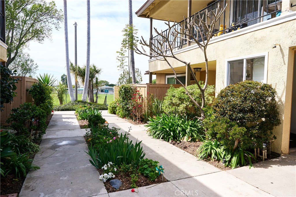 12310 La Pomelo Road La Mirada, CA 90638 - Photo 9 of 30 a view of a pathway with flower garden