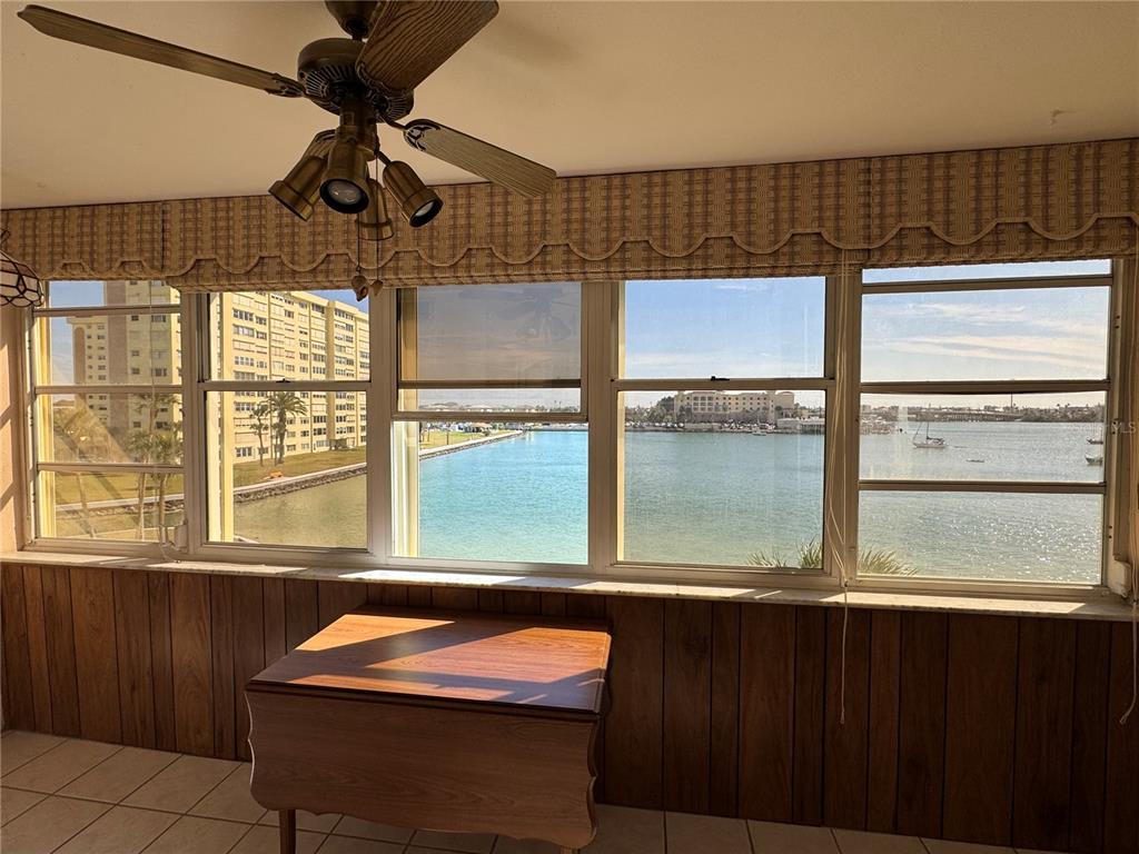4775 Cove Circle, Unit 403 St. Petersburg, FL 33708 - Photo 13 of 42 a room with a window and chandelier
