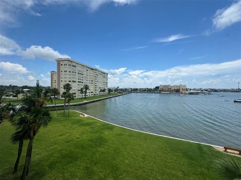 4775 Cove Circle, Unit 403 St. Petersburg, FL 33708 - Photo 14 of 42 a view of lake with green space
