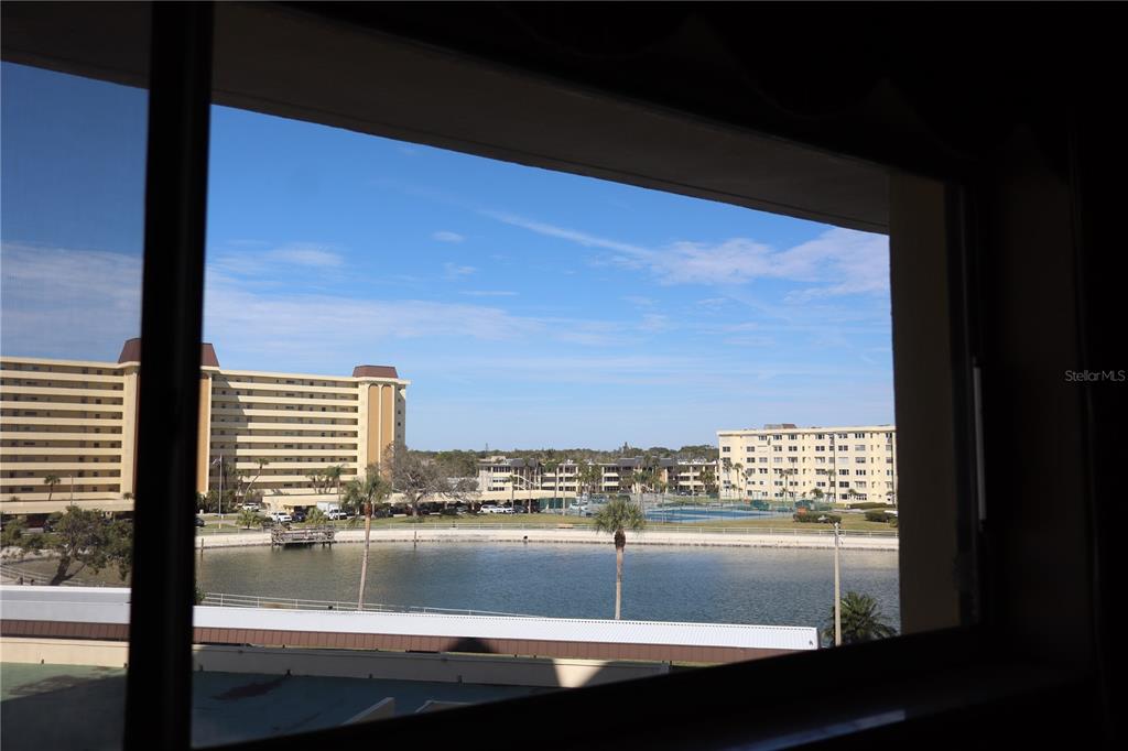 4775 Cove Circle, Unit 403 St. Petersburg, FL 33708 - Photo 19 of 42 a view of water heater