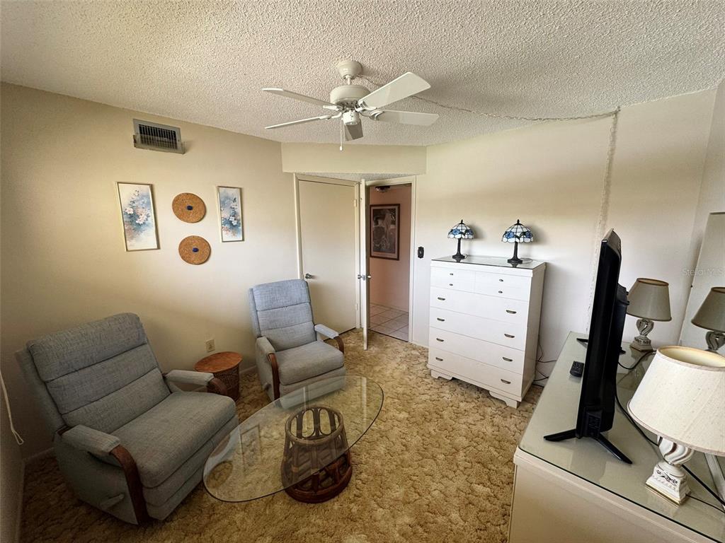 4775 Cove Circle, Unit 403 St. Petersburg, FL 33708 - Photo 20 of 42 a living room with furniture