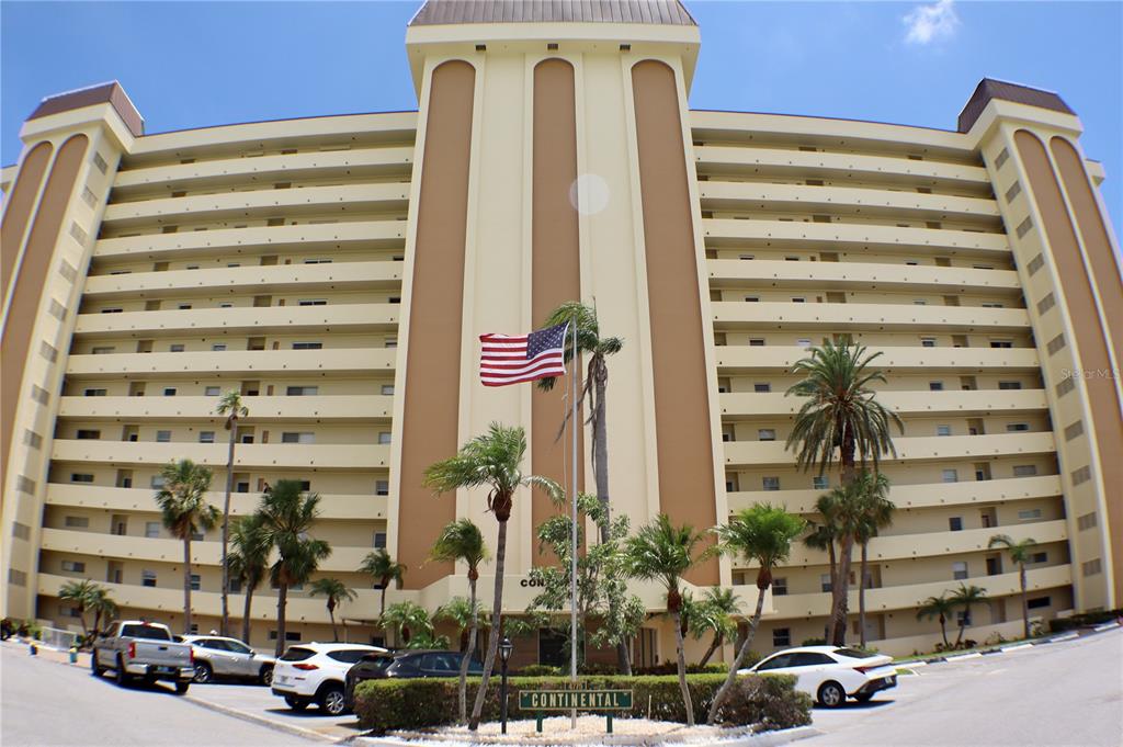 4775 Cove Circle, Unit 403 St. Petersburg, FL 33708 - Photo 2 of 42 a front view of a building with street view