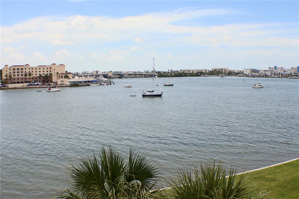 4775 Cove Circle, Unit 403 St. Petersburg, FL 33708 - Photo 21 of 42 a view of a lake with houses
