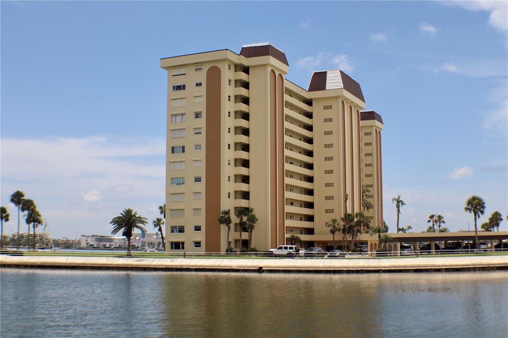 4775 Cove Circle, Unit 403 St. Petersburg, FL 33708 - Photo 23 of 42 a front view of a building with lake view