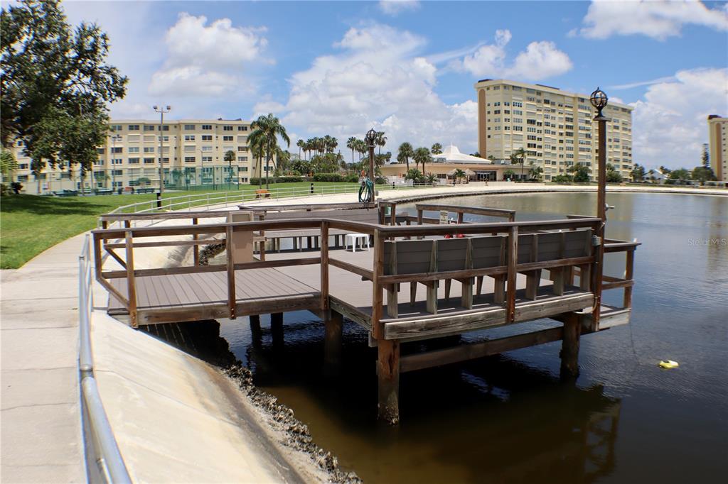 4775 Cove Circle, Unit 403 St. Petersburg, FL 33708 - Photo 27 of 42 a view of a balcony with two chairs and a table