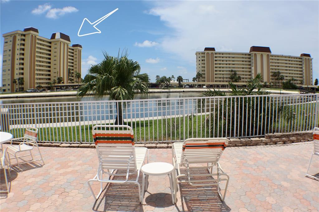 4775 Cove Circle, Unit 403 St. Petersburg, FL 33708 - Photo 32 of 42 a balcony with a couch