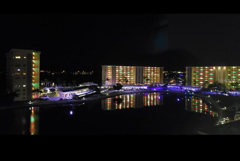 4775 Cove Circle, Unit 403 St. Petersburg, FL 33708 - Photo 35 of 42 a view of swimming pool and outdoor seating