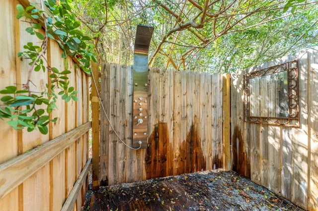a kitchen with cabinets and wooden floor