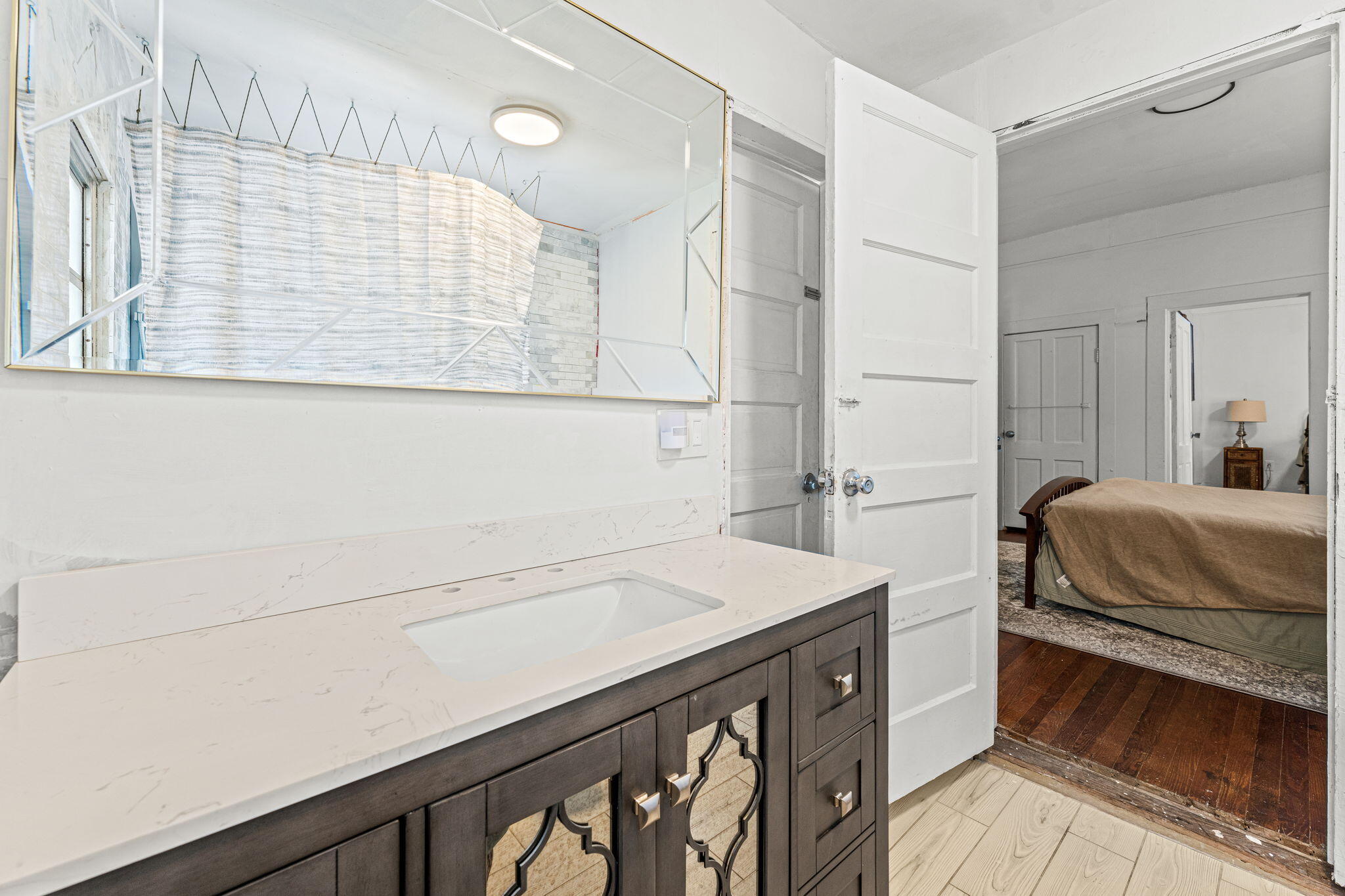 1365 Pineapple Avenue Melbourne, FL 32935 - Photo 29 of 46 a bathroom with a sink and a mirror