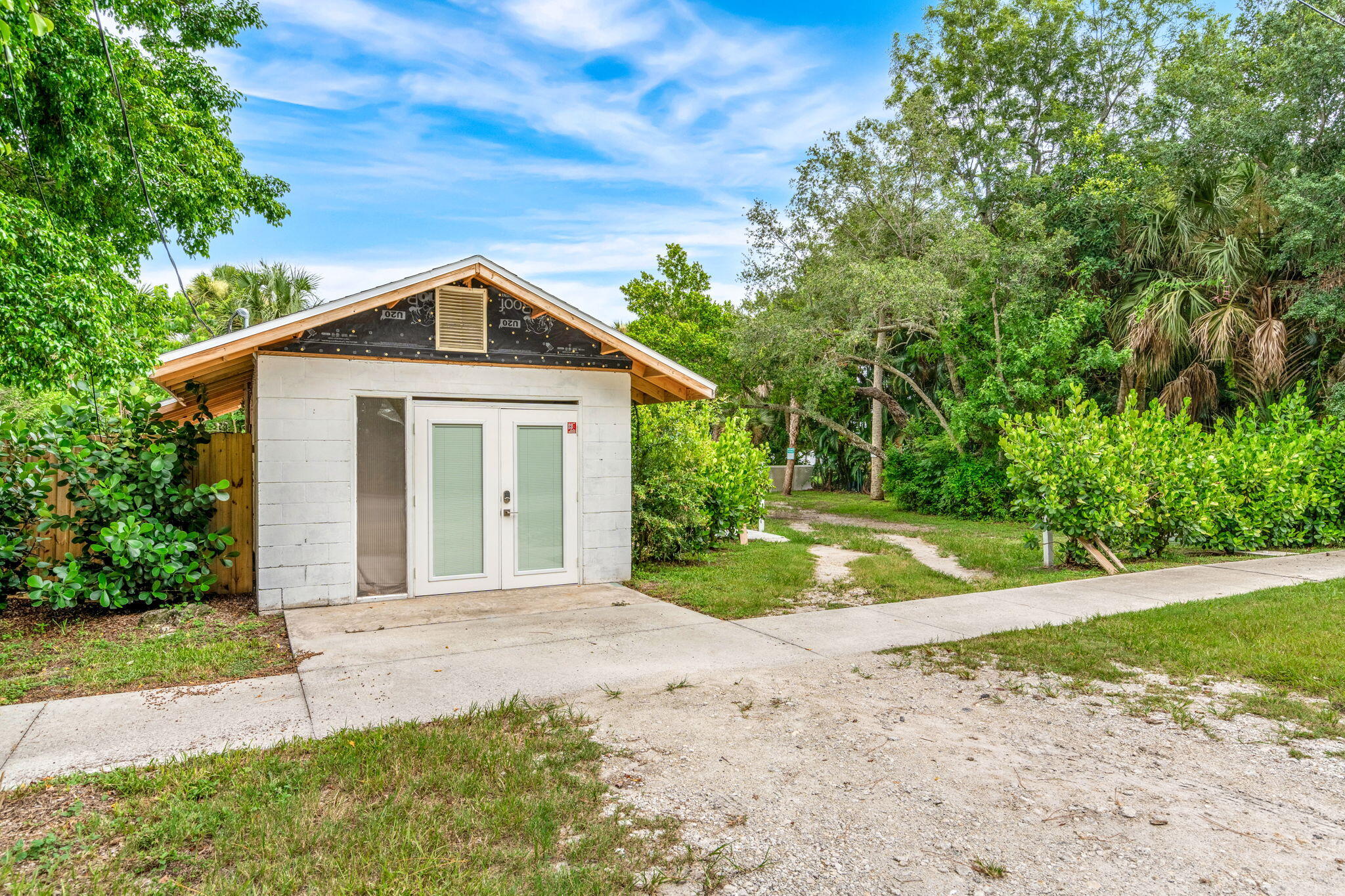 1365 Pineapple Avenue Melbourne, FL 32935 - Photo 32 of 46 a front view of a house with a yard