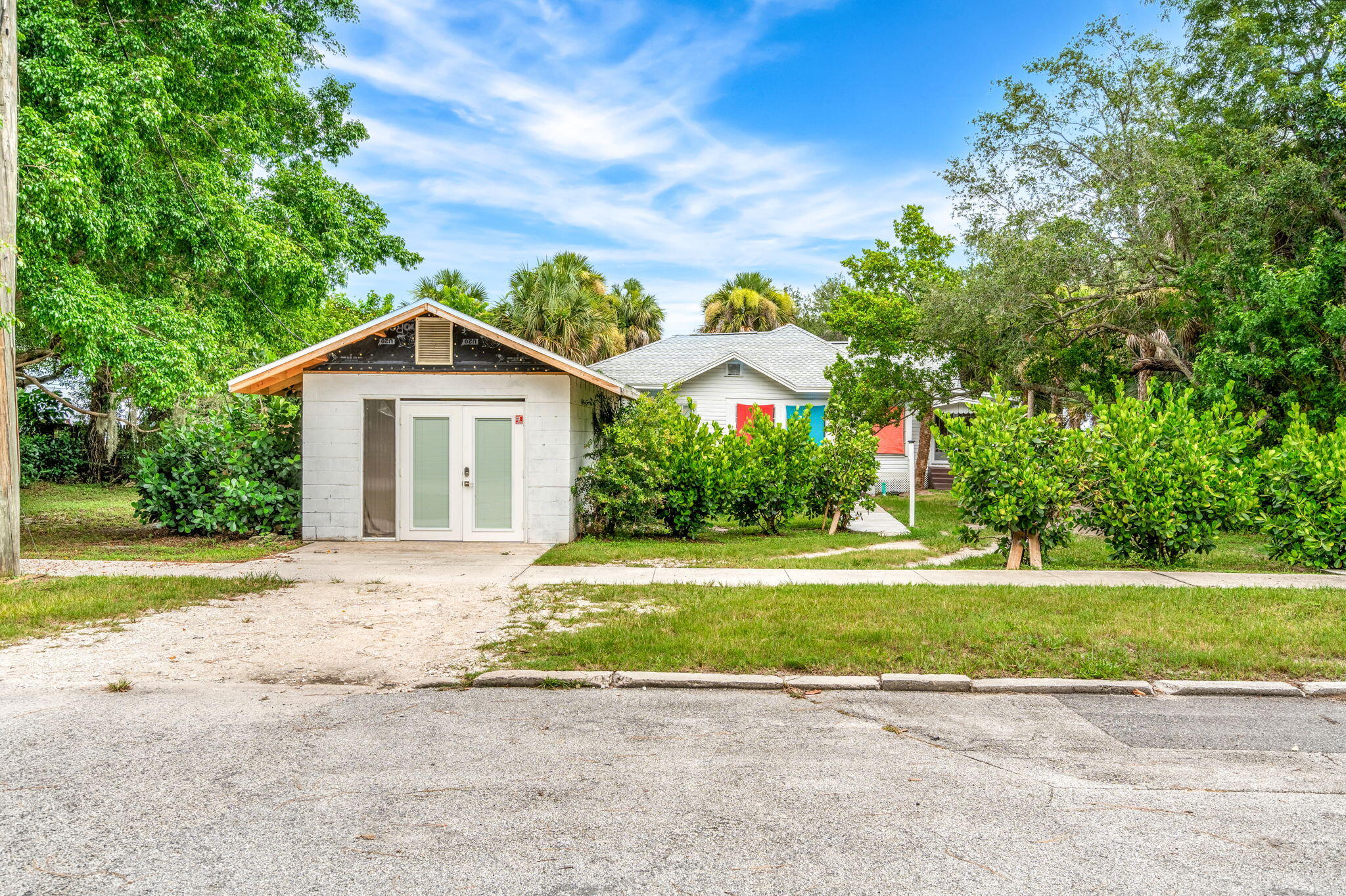 1365 Pineapple Avenue Melbourne, FL 32935 - Photo 9 of 46 a front view of a house with a yard