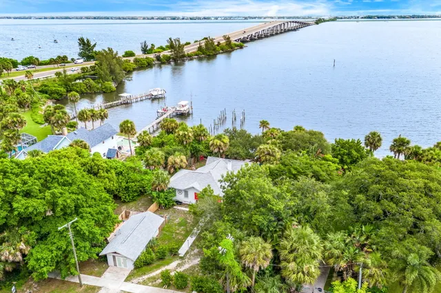 a view of a chairs and table in backyard