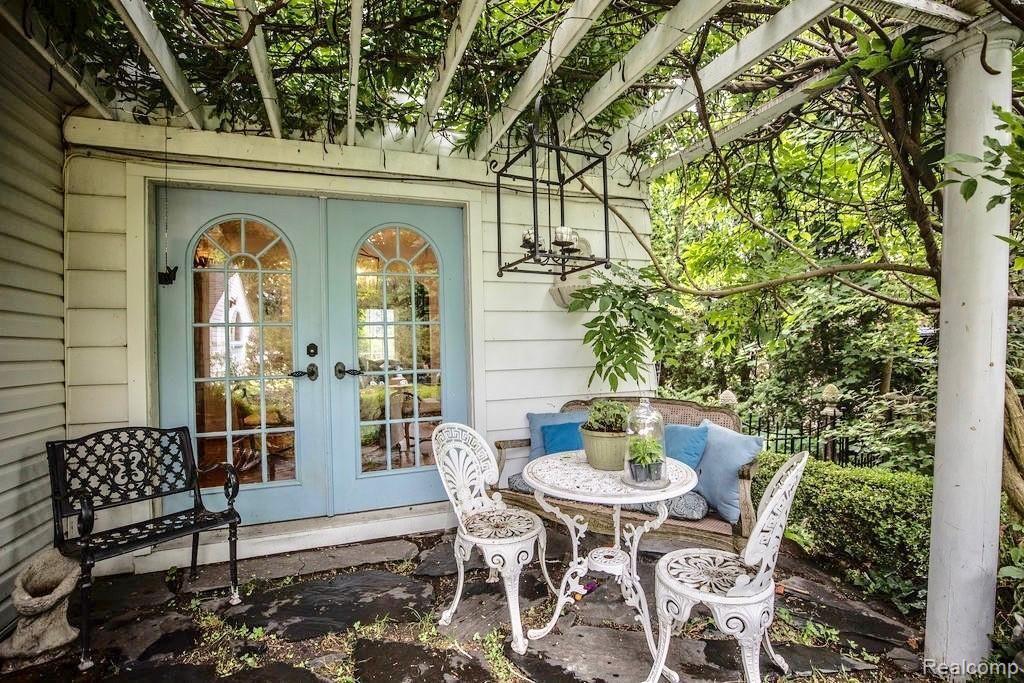 1605 Crooks Road Royal Oak, MI 48067 - Photo 31 of 37 Pergola covered Back Porch with Wisteria