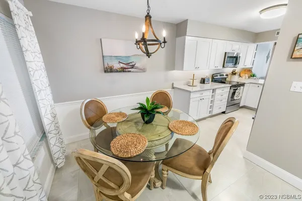 a view of dining table and chairs