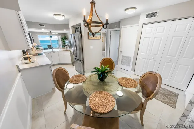 a dining room with furniture and wooden floor
