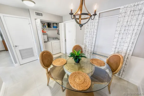 a table room with furniture and wooden floor