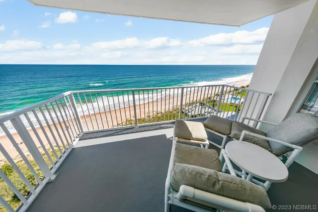 a view of a balcony with furniture