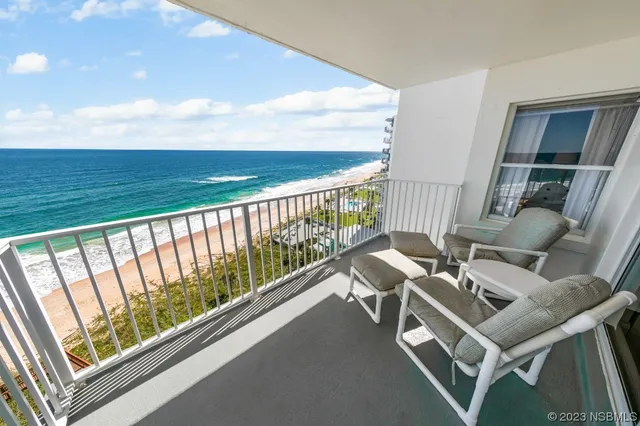 a view of balcony with furniture