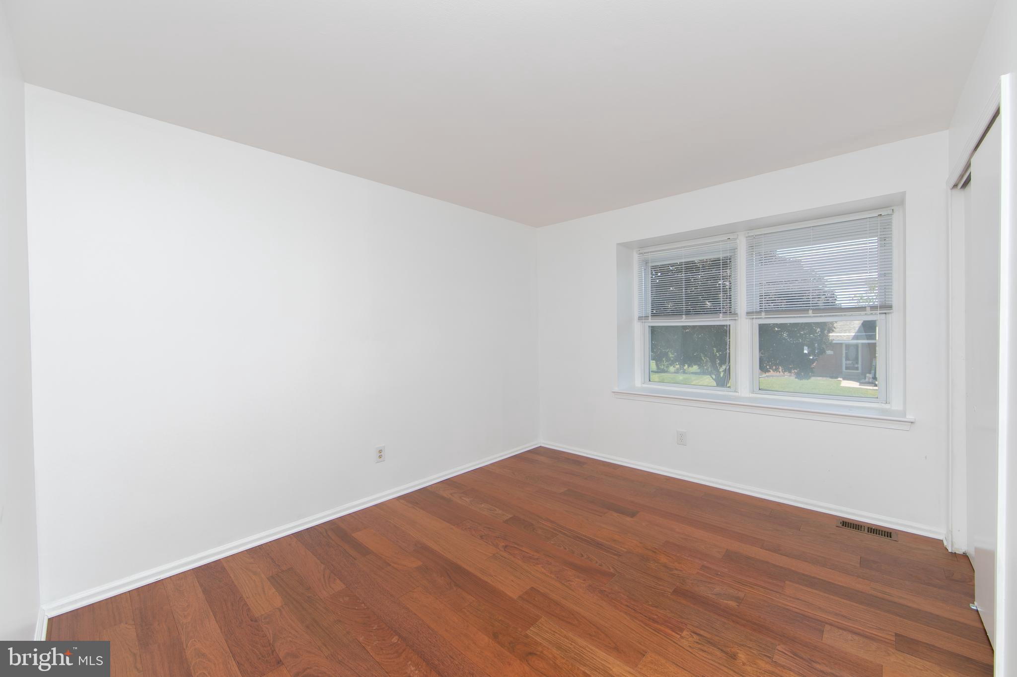 3007 Rampart Road Bensalem, PA 19020 - Photo 33 of 48 a view of empty room with wooden floor and fan