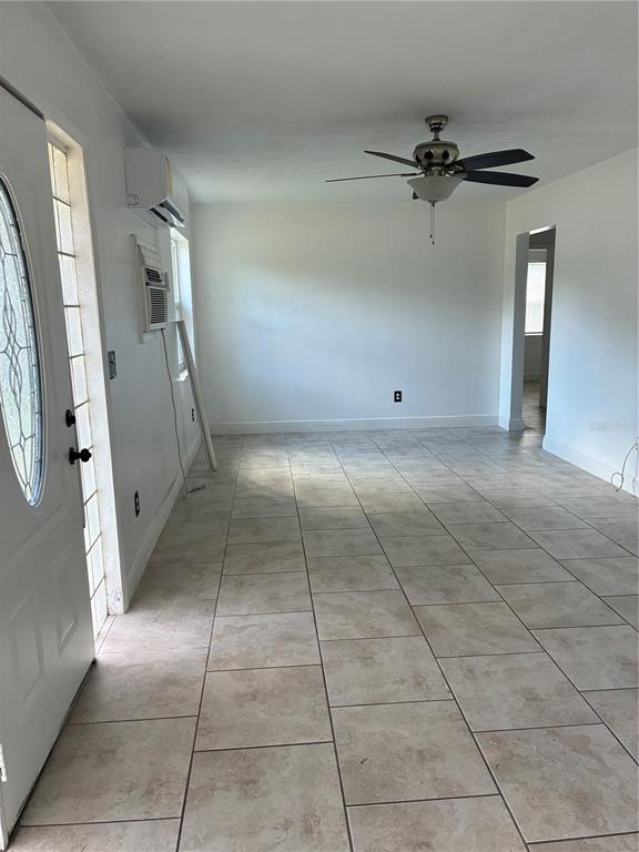 1500 Daroca Drive Deltona, FL 32725 - Photo 17 of 22 wooden floor in a room and a white cabinet