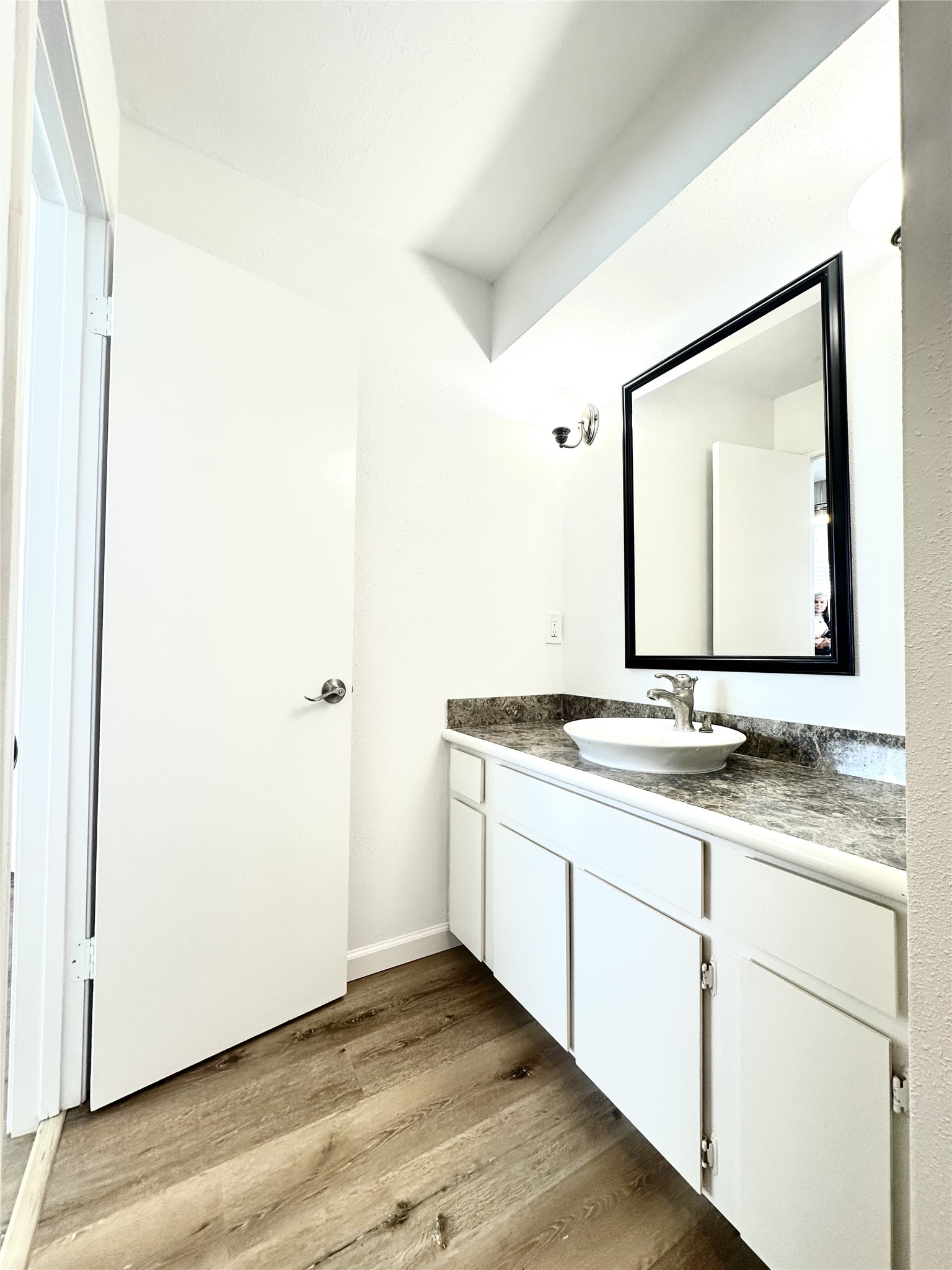 14771 Perthshire Road Houston, TX 77079 - Photo 13 of 23 a bathroom with a granite countertop sink and a mirror