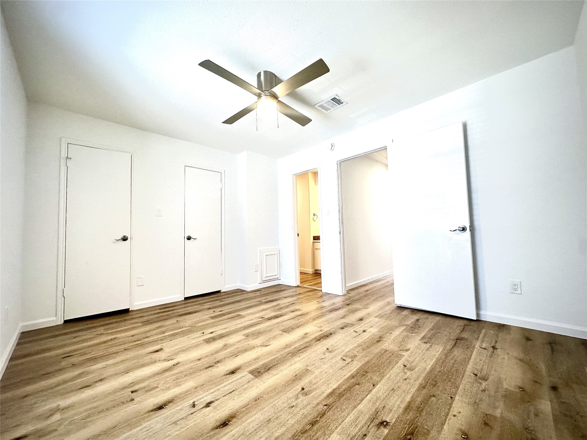 14771 Perthshire Road Houston, TX 77079 - Photo 16 of 23 a view of a room with wooden floor