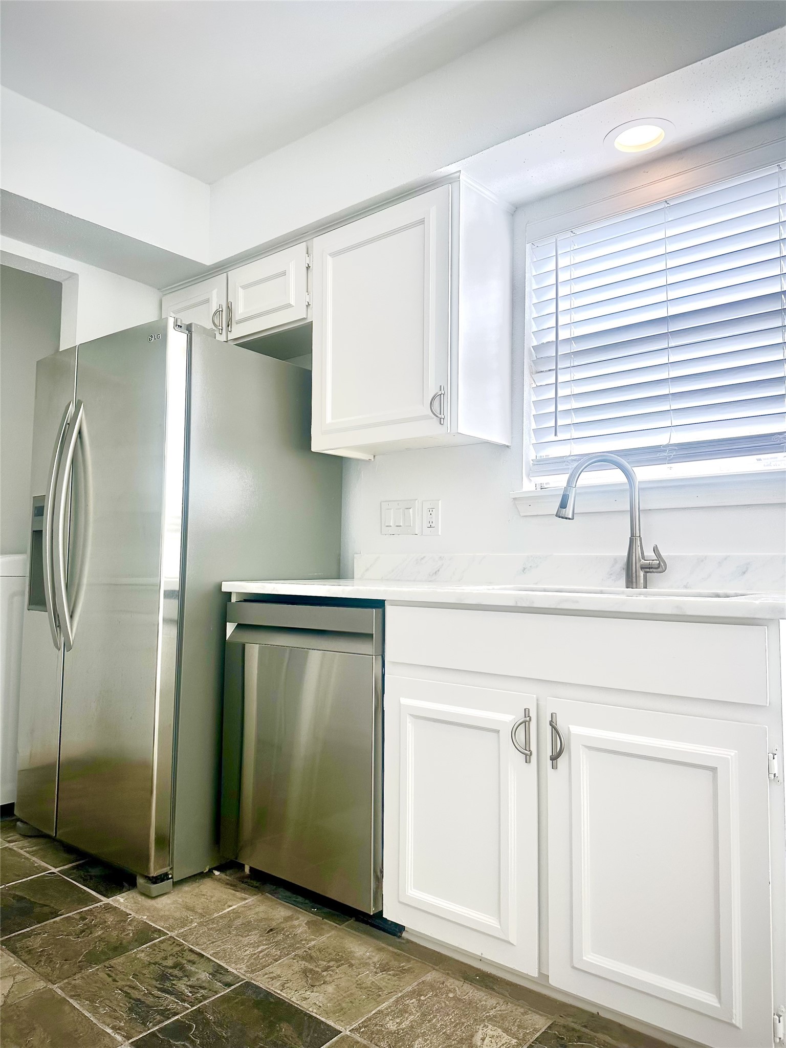 14771 Perthshire Road Houston, TX 77079 - Photo 5 of 23 a kitchen with stainless steel appliances cabinets and a counter top space