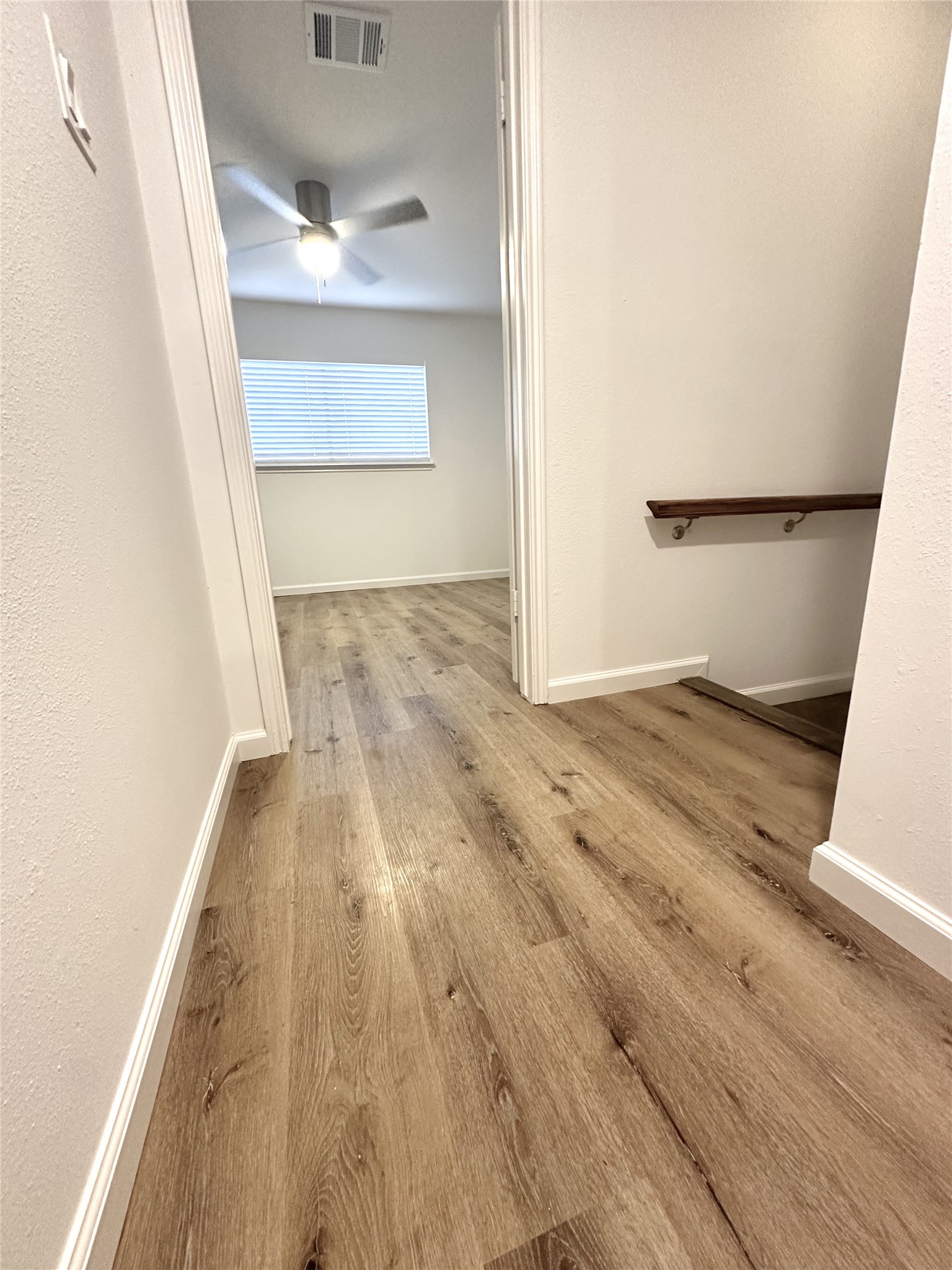 14771 Perthshire Road Houston, TX 77079 - Photo 9 of 23 a view of empty room with wooden floor