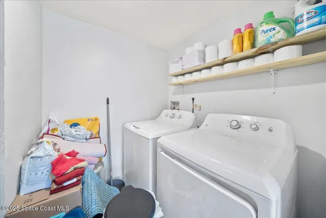 a utility room with dryer and washer