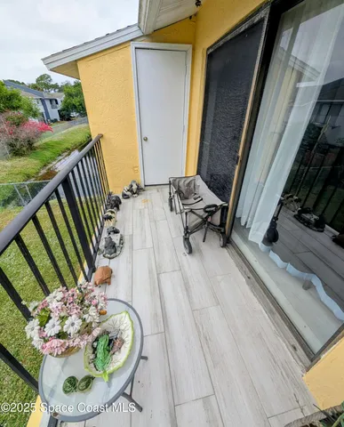 a backyard of a house with outdoor seating