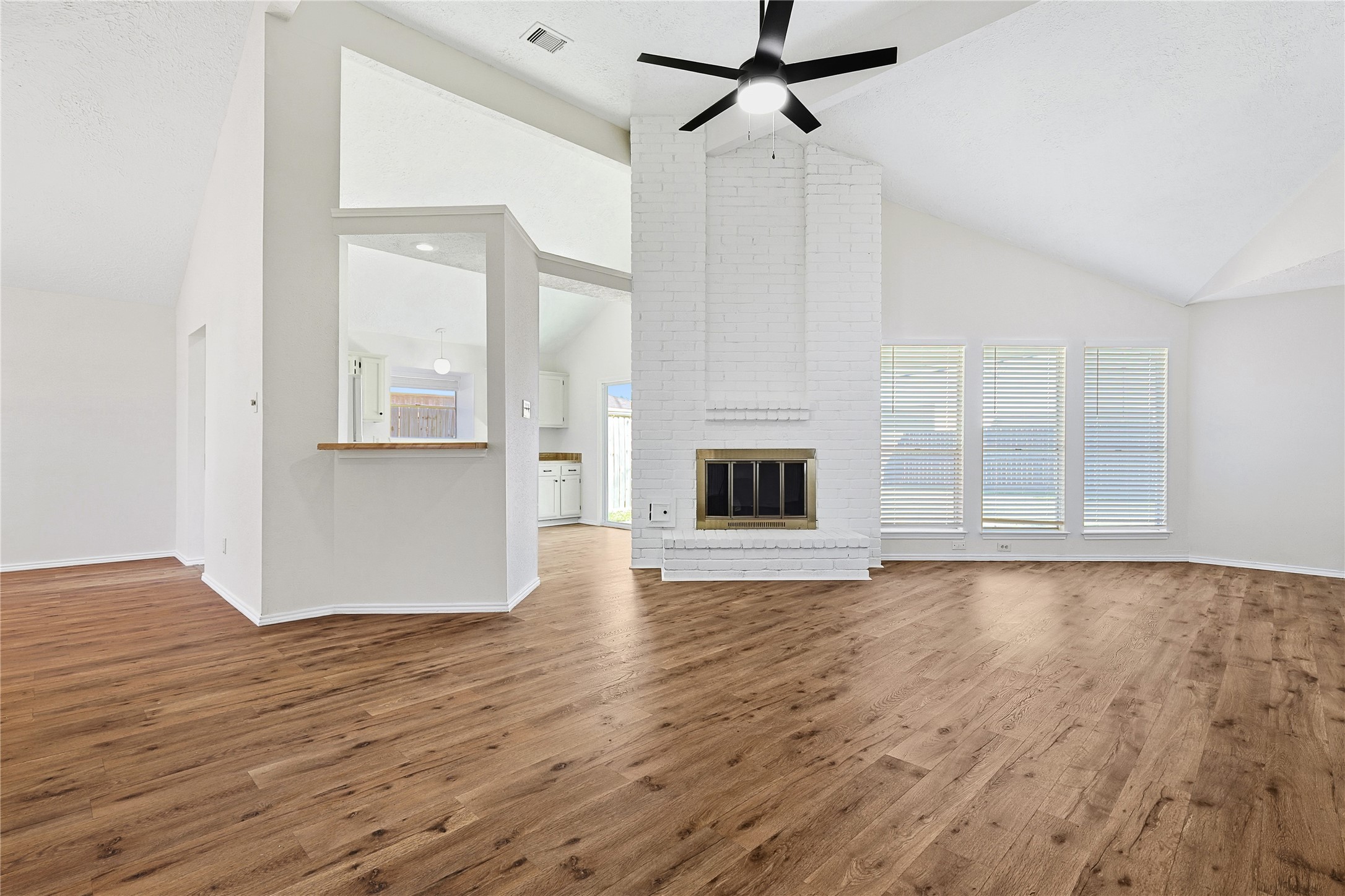 19006 Keyturn Lane Humble, TX 77346 - Photo 3 of 21 a view of a livingroom with wooden floor and a kitchen space
