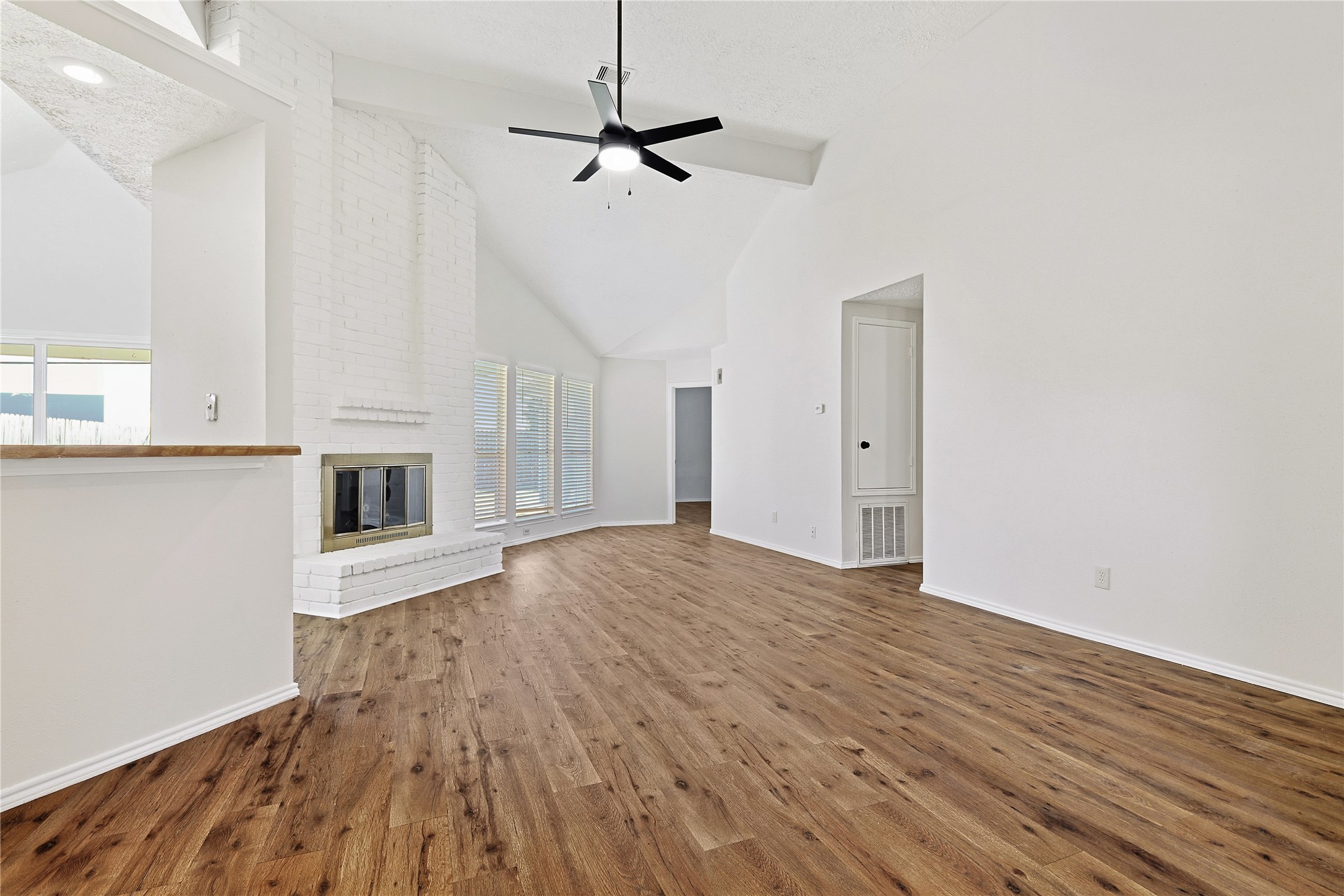 19006 Keyturn Lane Humble, TX 77346 - Photo 4 of 21 a view of empty room with wooden floor and fan