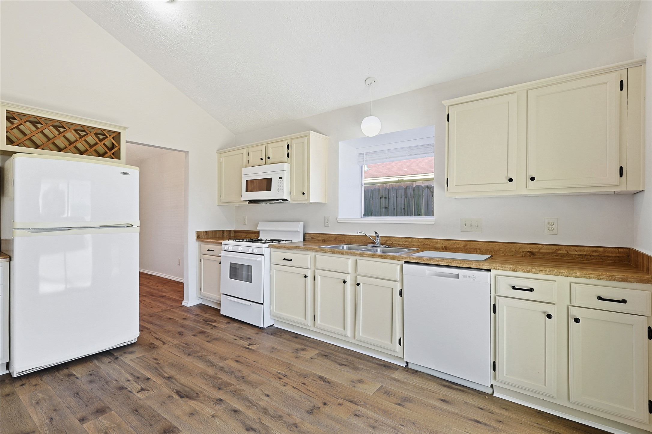 19006 Keyturn Lane Humble, TX 77346 - Photo 8 of 21 a kitchen with granite countertop white cabinets and white appliances