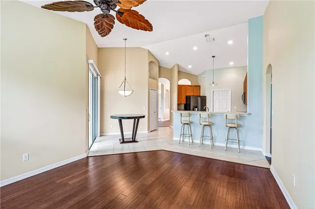 a view of a dining room with furniture and wooden floor