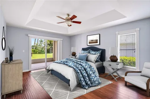 a spacious bedroom with a bed and a couch