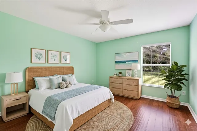 a bedroom with furniture and a wooden floor