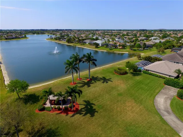 an aerial view of a house with a lake view