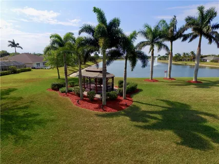 a view of a park with swings and slides