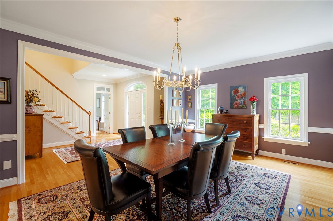 3620 Old Gun Road East Midlothian, VA 23113 - Photo 13 of 56 a view of a dining room with furniture window and wooden floor