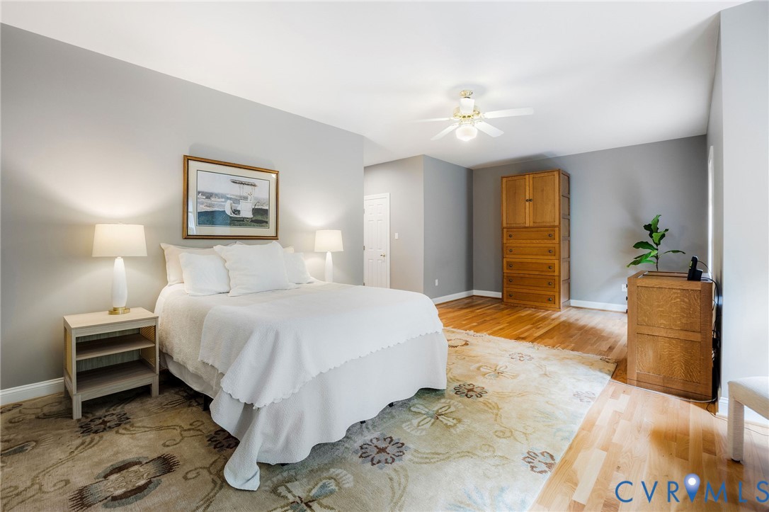 3620 Old Gun Road East Midlothian, VA 23113 - Photo 24 of 56 a spacious bedroom with a bed and a chandelier
