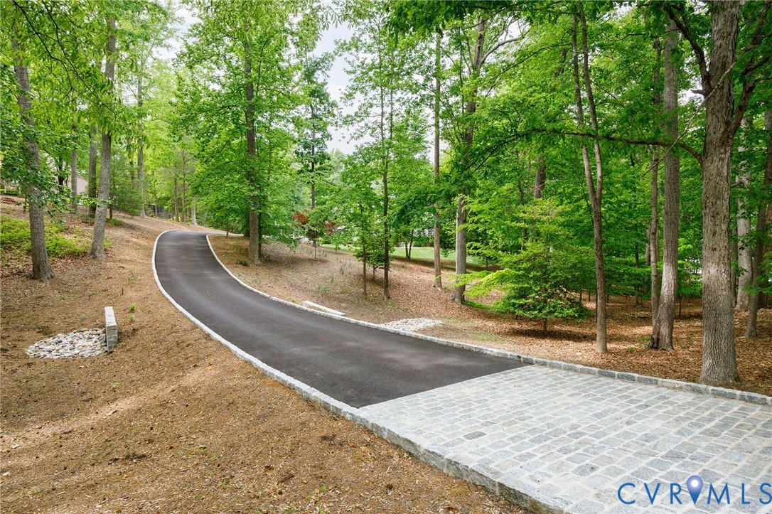 3620 Old Gun Road East Midlothian, VA 23113 - Photo 6 of 56 Custom driveway with landscape lighting and cobble