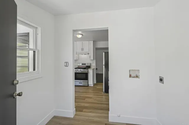 a view of a kitchen from the hallway