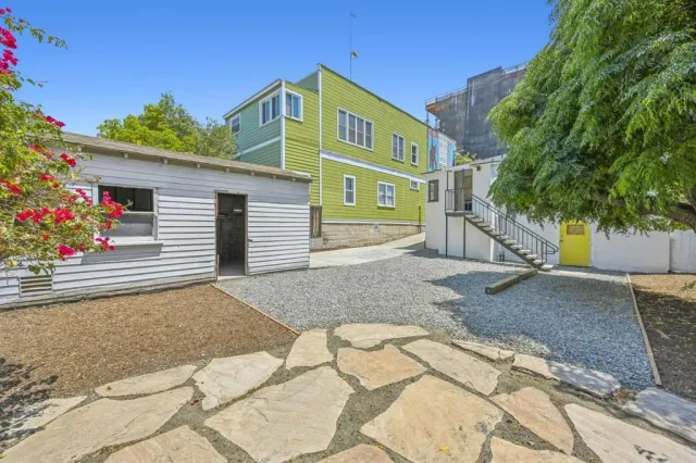a front view of a house with a yard and a garage
